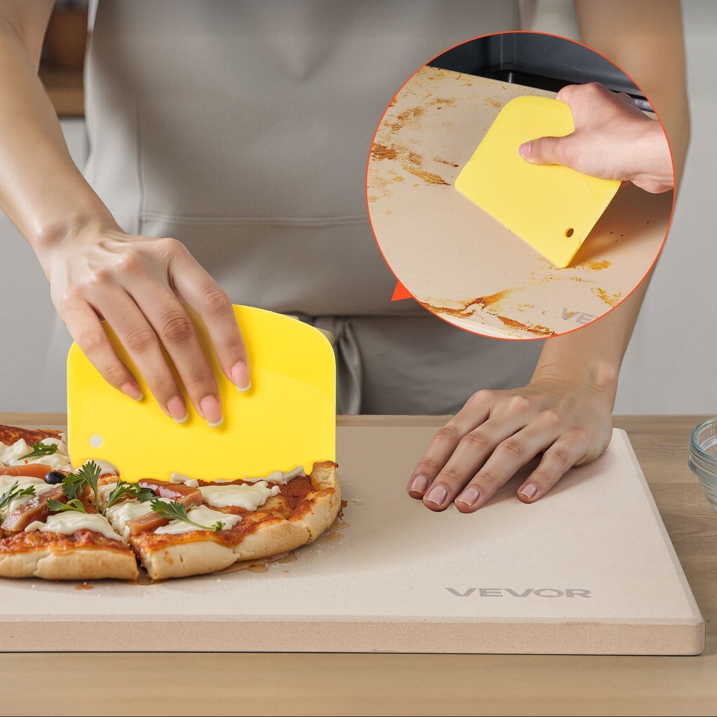 Person using a yellow multi-purpose scraper on a pizza on a pizza stone