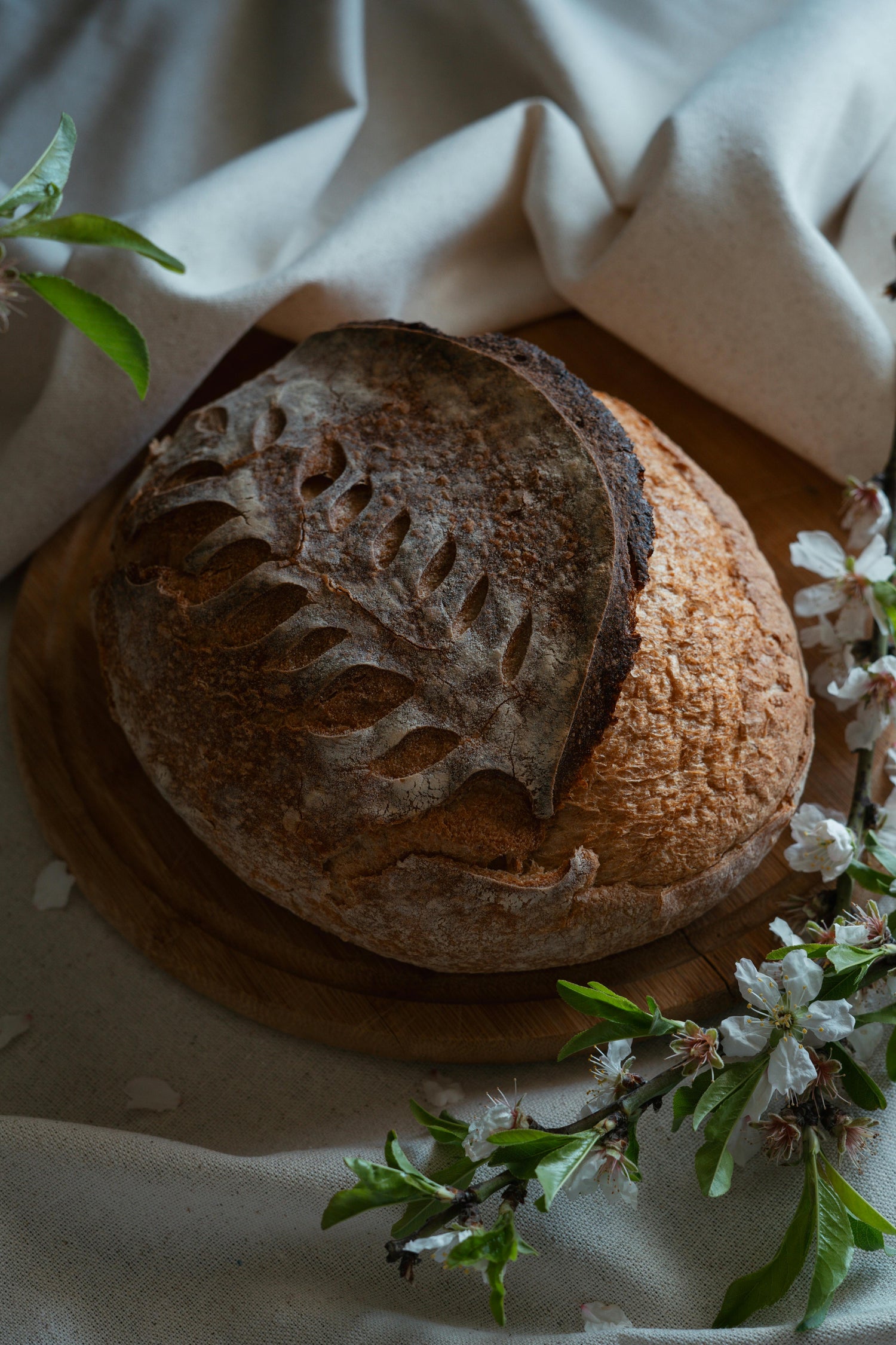 Homemade sourdough bread with baking tools