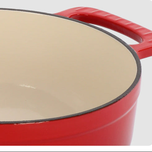 Round cast iron dutch oven with lid in red color