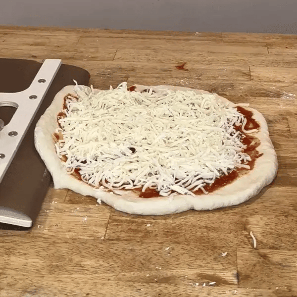 Pizza peel tool for easy oven transfer of homemade dough
