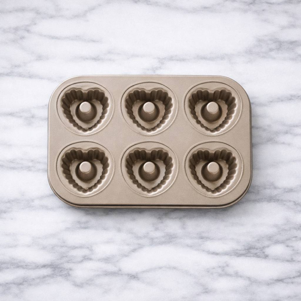 Homemade donut baking mold in gold finish